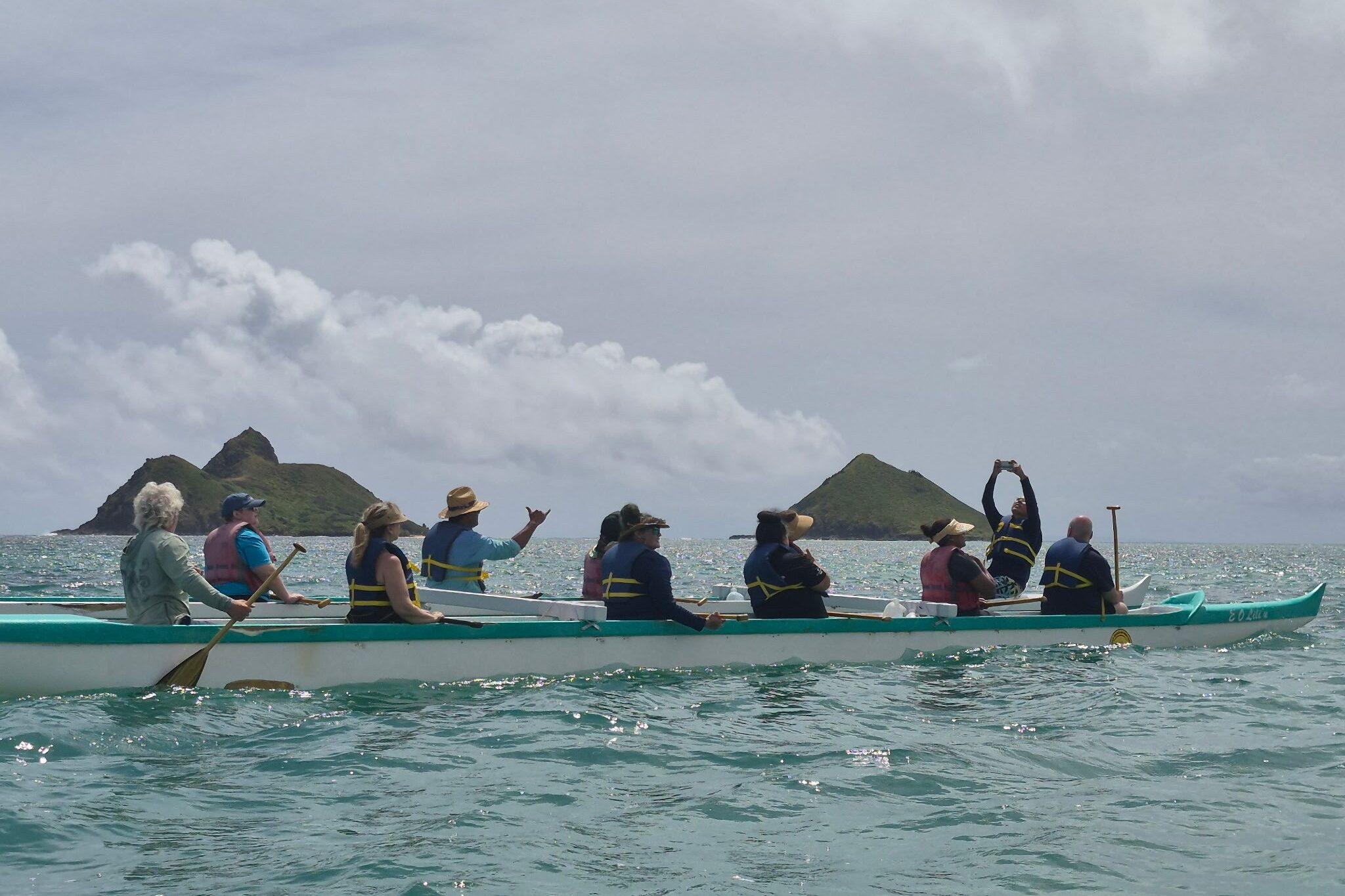 Governing board on sea kayak rig in Hawaii